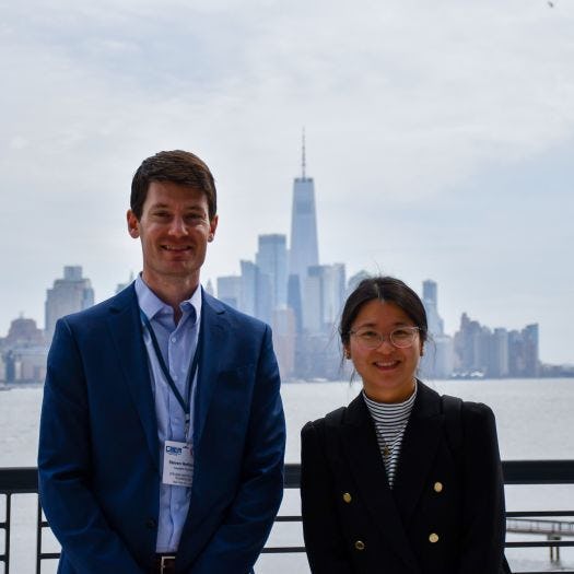 Stevens professors Steven Hoffenson and Lu Xiao with New York City in the background
