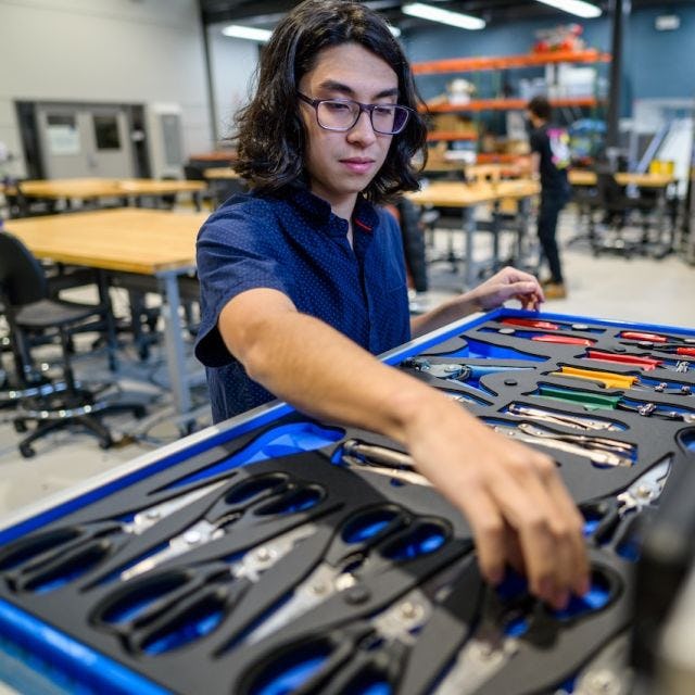 A student using the MakerCenter tool chest