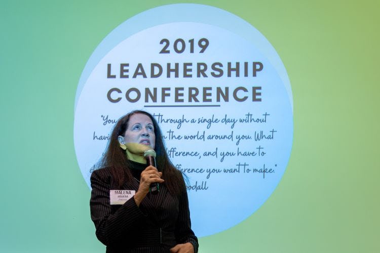 speaker in front of slide that reads 2019 leadhership conference