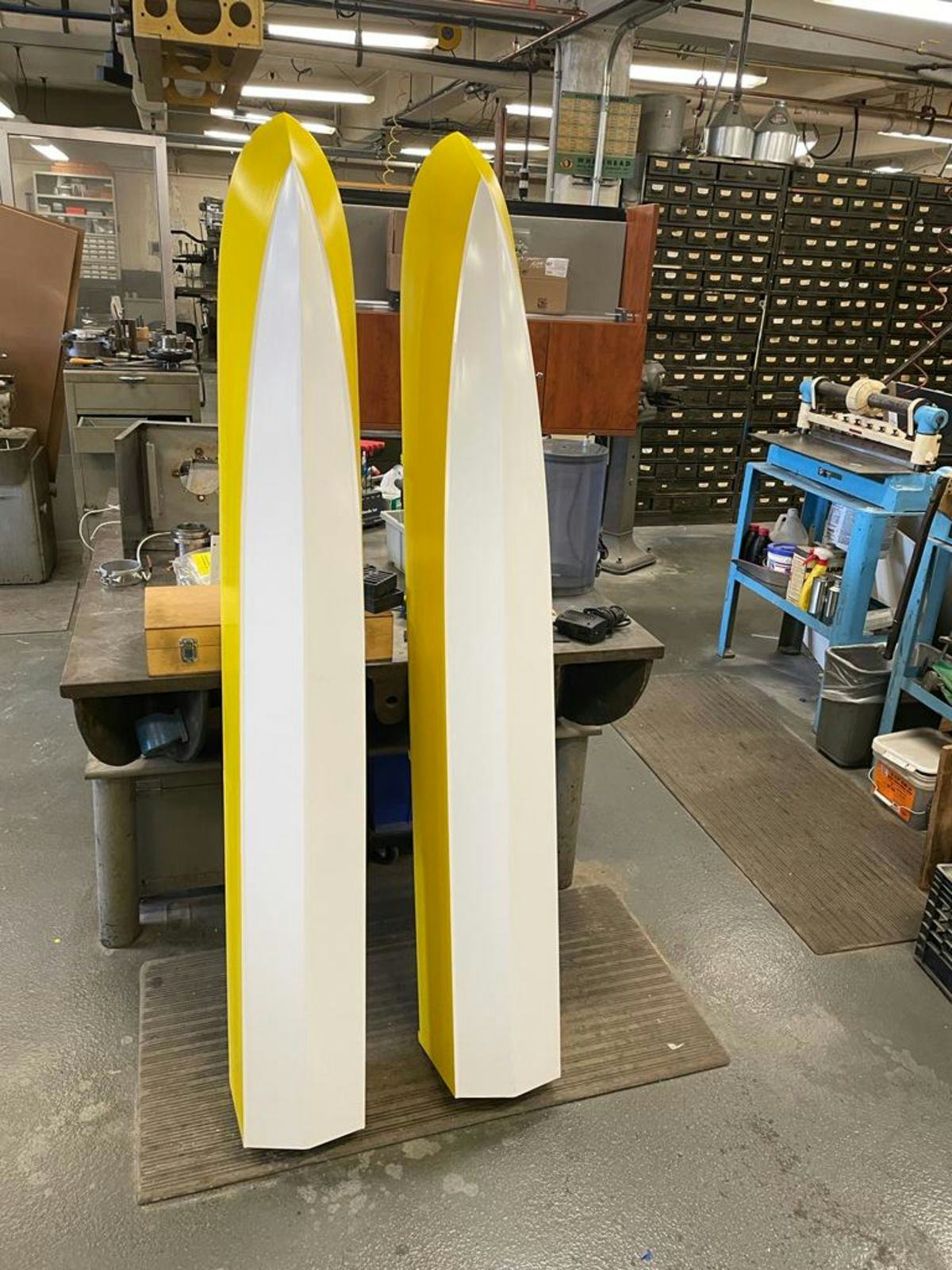 Two yellow hulls of a catamaran-style craft stacked in Stevens' Davidson Lab