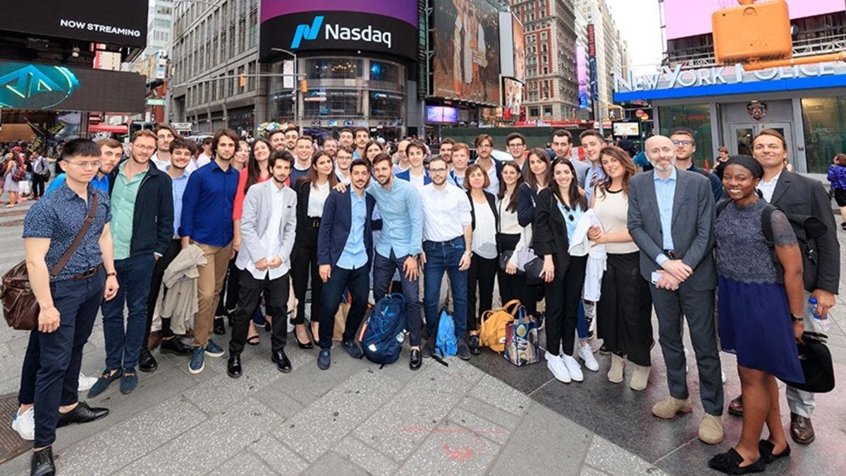 Students standing in Times Square during a visit to the offices of Nasdaq.