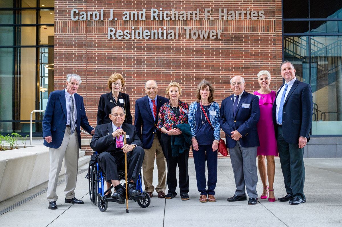 Donors and friends outside the UCC at the Carol J. and Richard F. Harries Residential Tower.