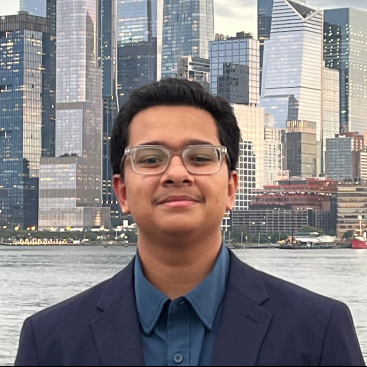 Aditya Velamuri with the New York City skyline in the background.
