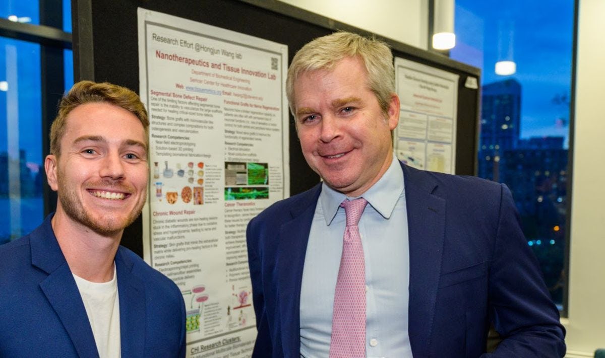 Brian Semcer and Ph.D. candidate Christian Buckley at CHI relaunch event