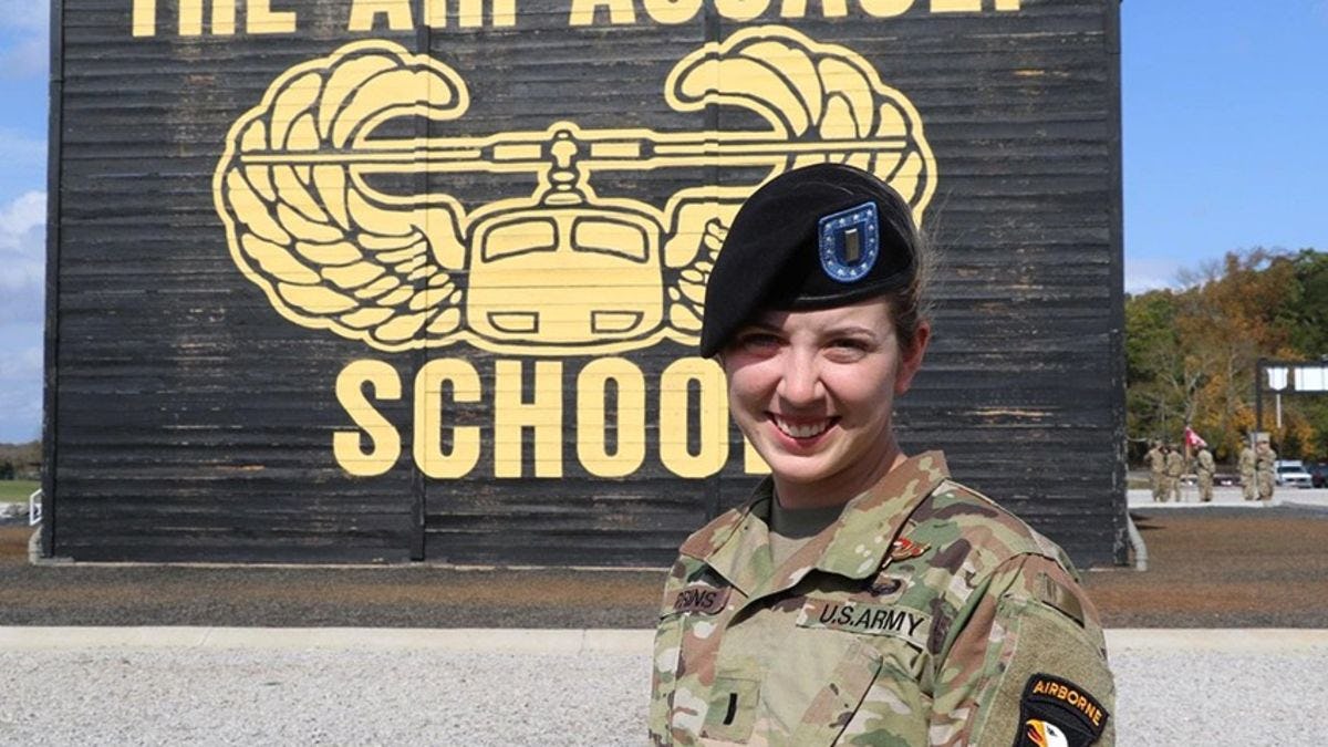 Molly Prins in her Army camouflage at a graduation ceremony.