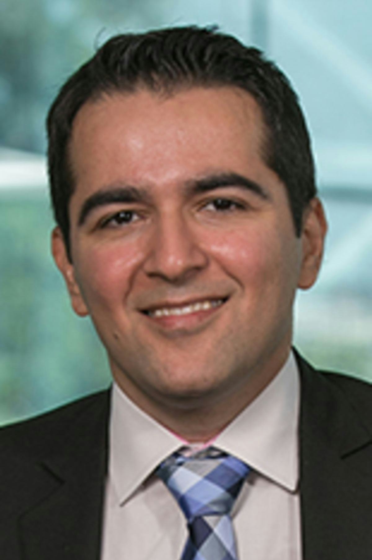 Headshot of Dr. Amir Gandomi with the New York City skyine in the background.