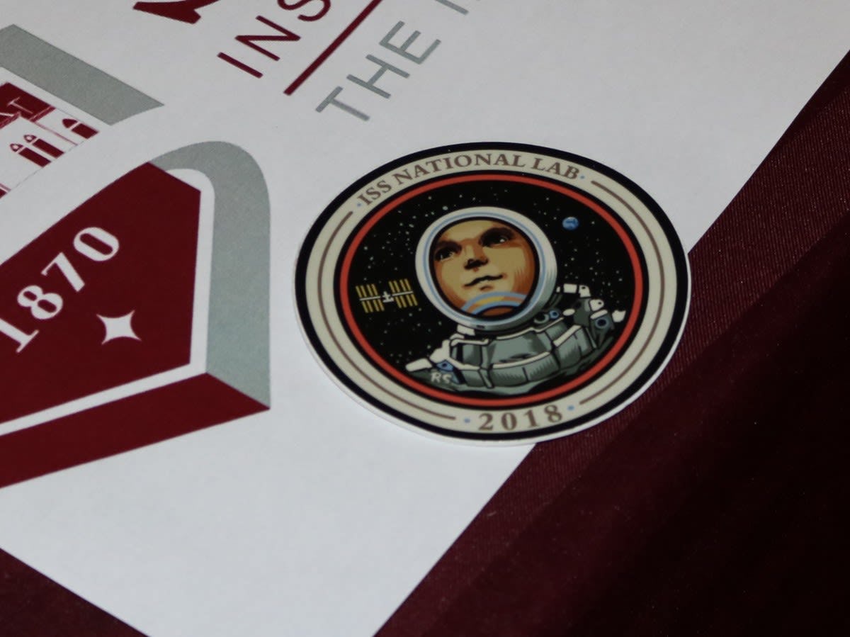 CAPTION: The 2018 ISS patch on top of the Stevens logo. CREDIT: Stevens.