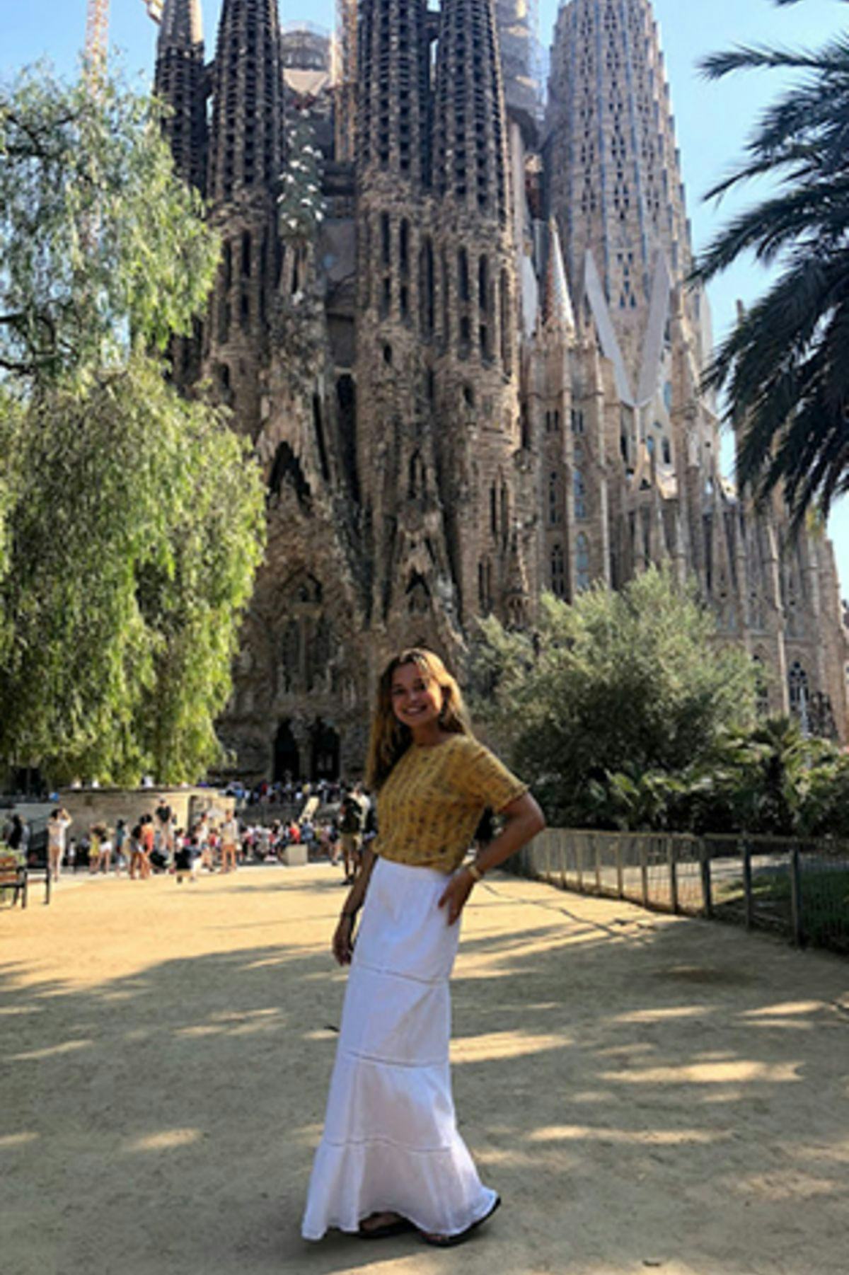 Stevens student Caitlin Haggerty standing in front of La Sagrada Familia Basilica in Barcelona.