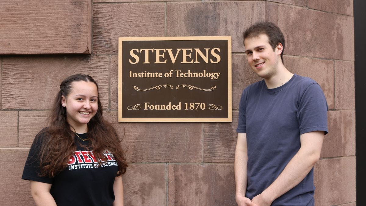 Tsinghua scholarship recipients Mary McNeil and Matthew Falco in front of the Edwin A. Stevens building.