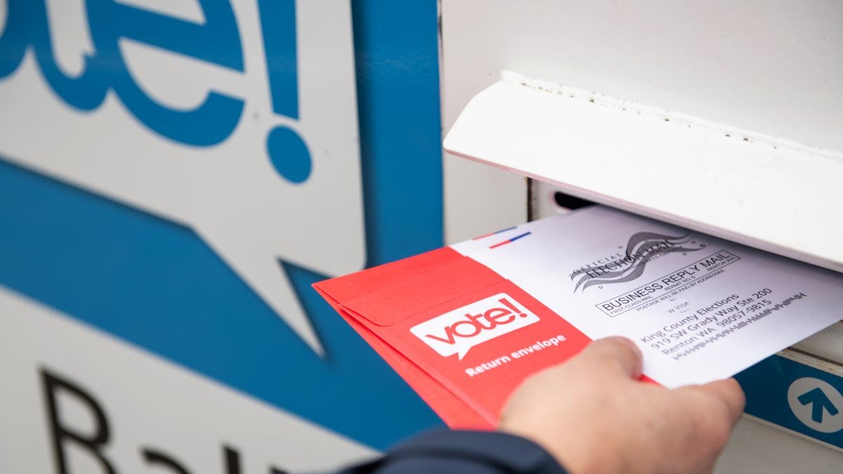 Person mailing an election ballot