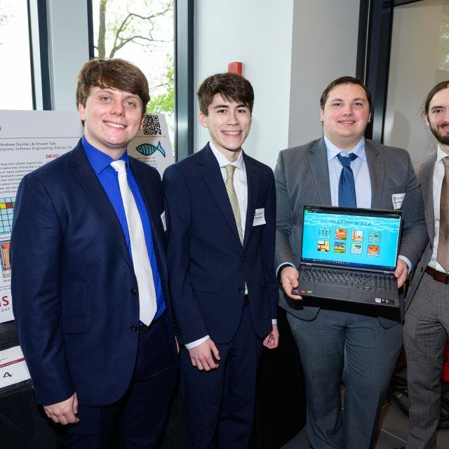 The Software Engineering eFish n' Sea team at the 2023 Innovation Expo. From left to right: Vincent Tufo, Andrew Quinlan, Jonathan Morrone and Ryan Mercadante.