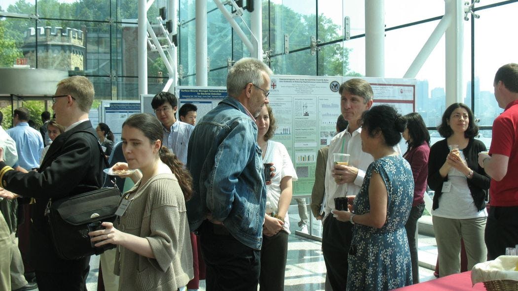 attendees at the first Stevens Conference on Bacteria-Material Interactions poster session
