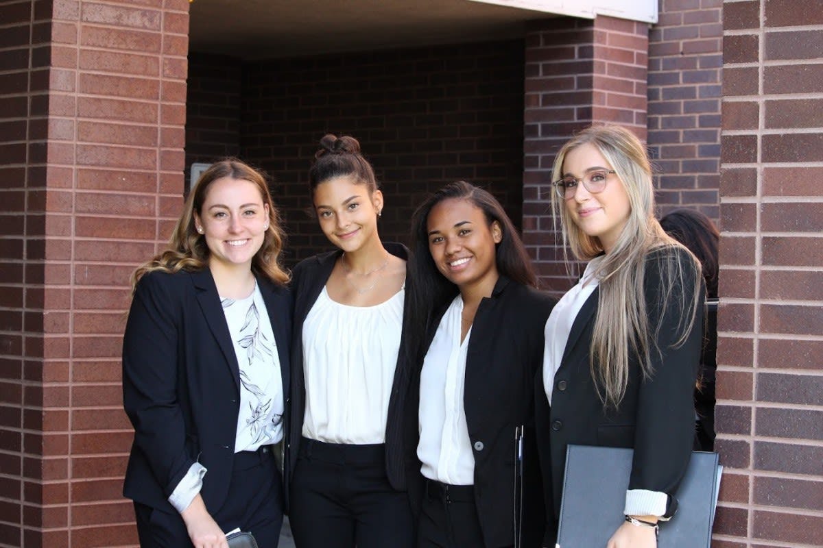 Four female students outside Schaefer Center, one of the venues of the fall 2019 Career Fair