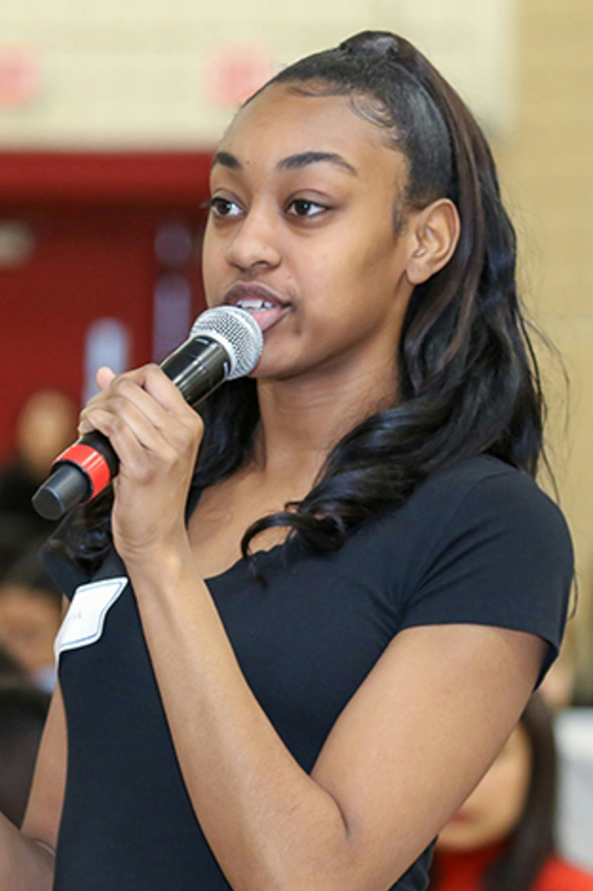 Photo of high school senior Dyana Givens asking a question.