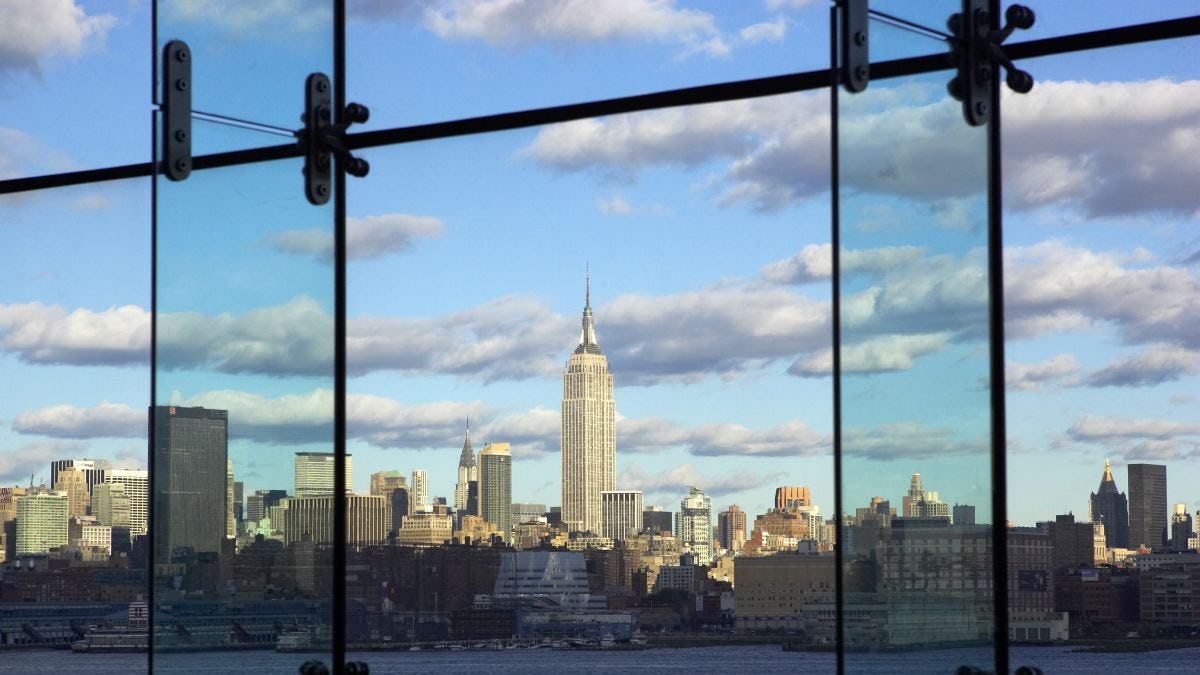 A view of lower Manhattan's skyline from Babbio's atrium. The shot is taken from inside the atrium, which consists of floor to ceiling windows.