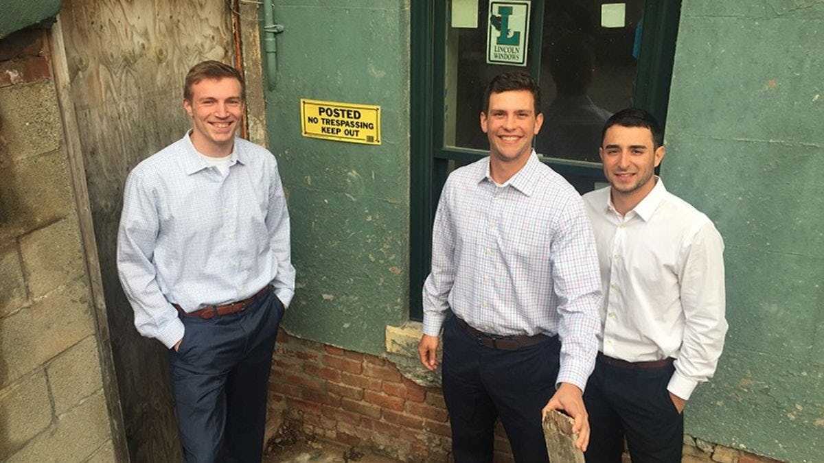 The FlipTrack team at a foreclosed home in Hoboken.