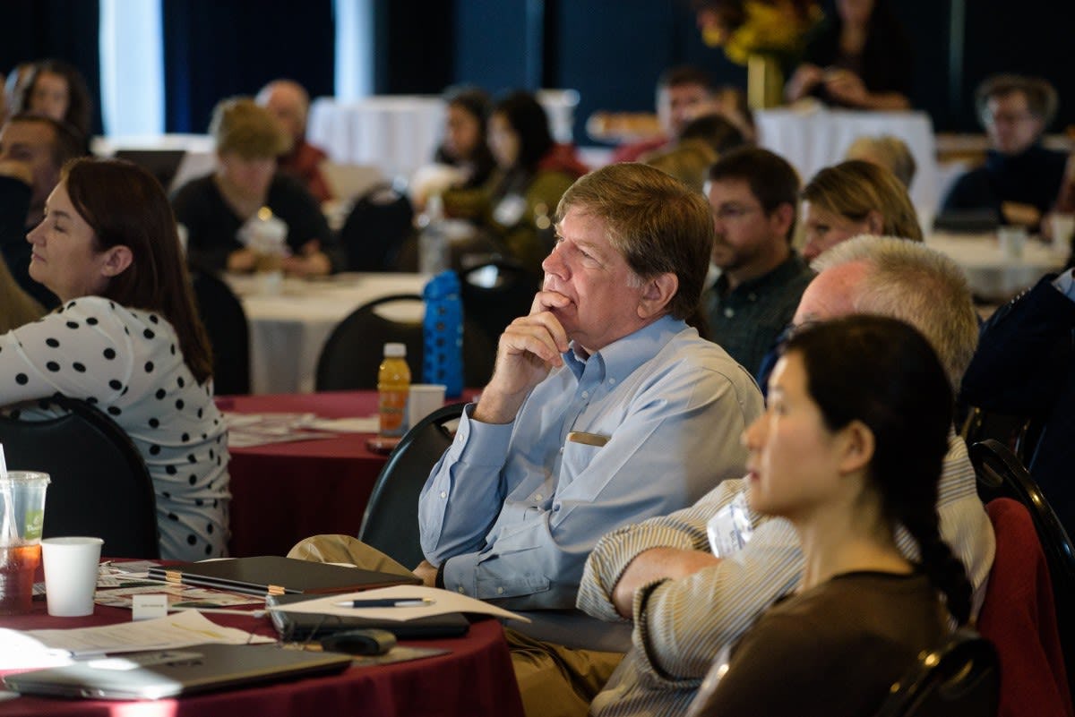 Participants listen at the conference
