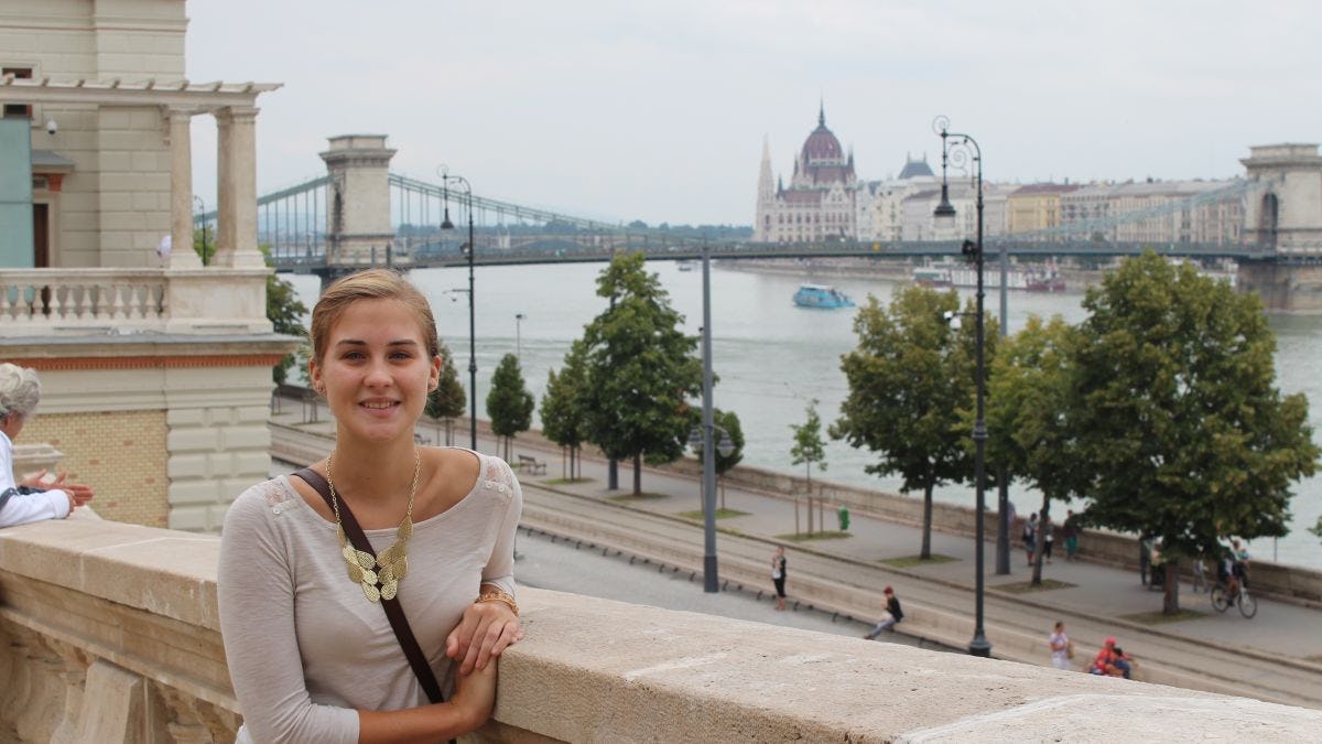 Nicole Fosko standing in front of the Danube River in Budapest, Hungary