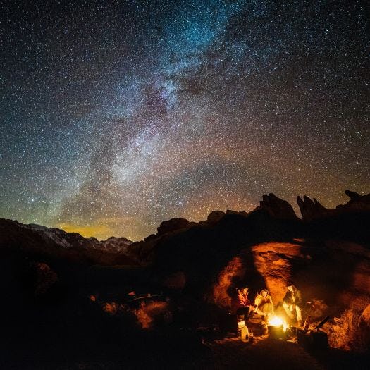 photo of people camping under the stars