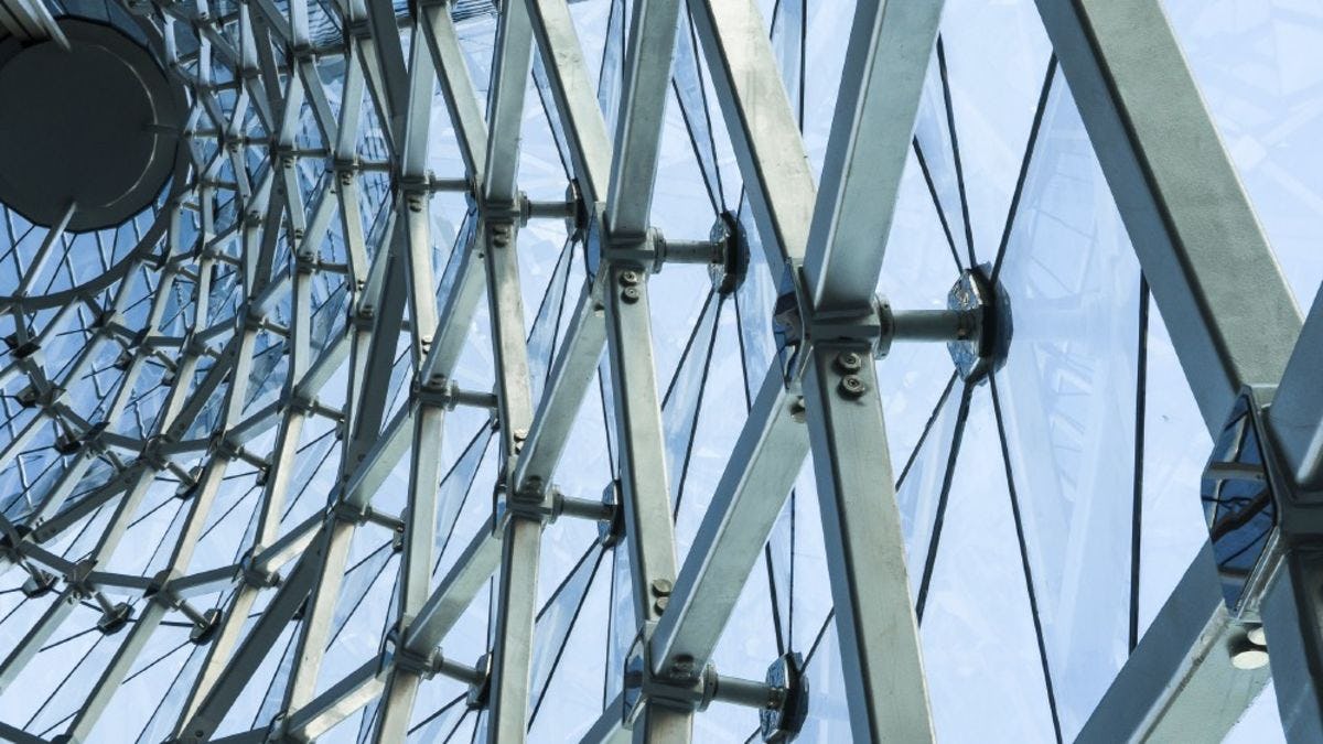 Image of glass and metal structure representative of systems