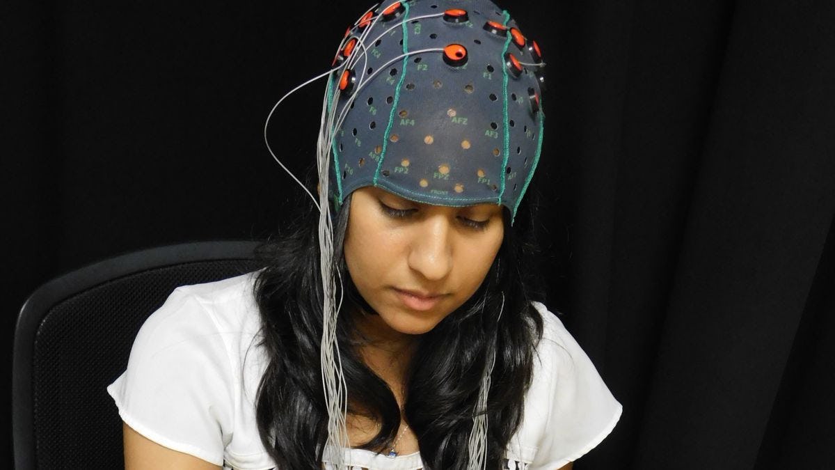 Vrajeshri Patel demonstrates her neural recording cap