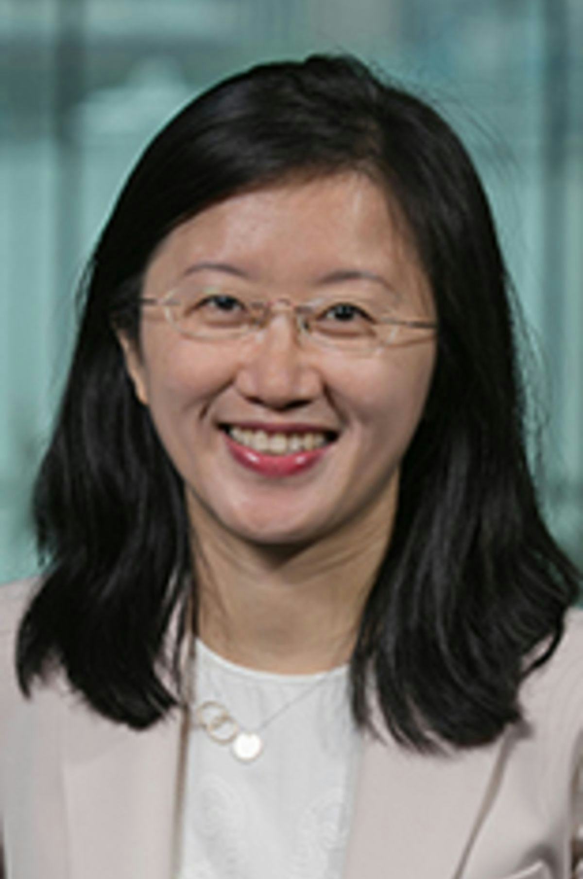 Headshot of Dr. Ying Wu with New York City in the background.