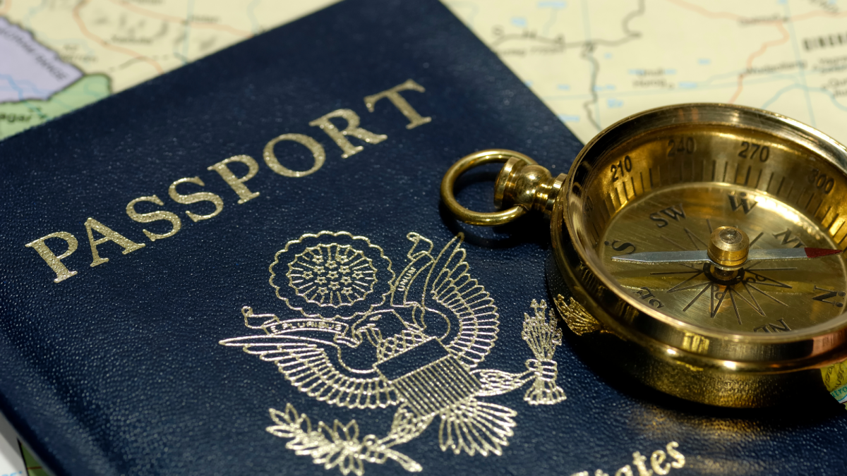 Passport, compass, and map