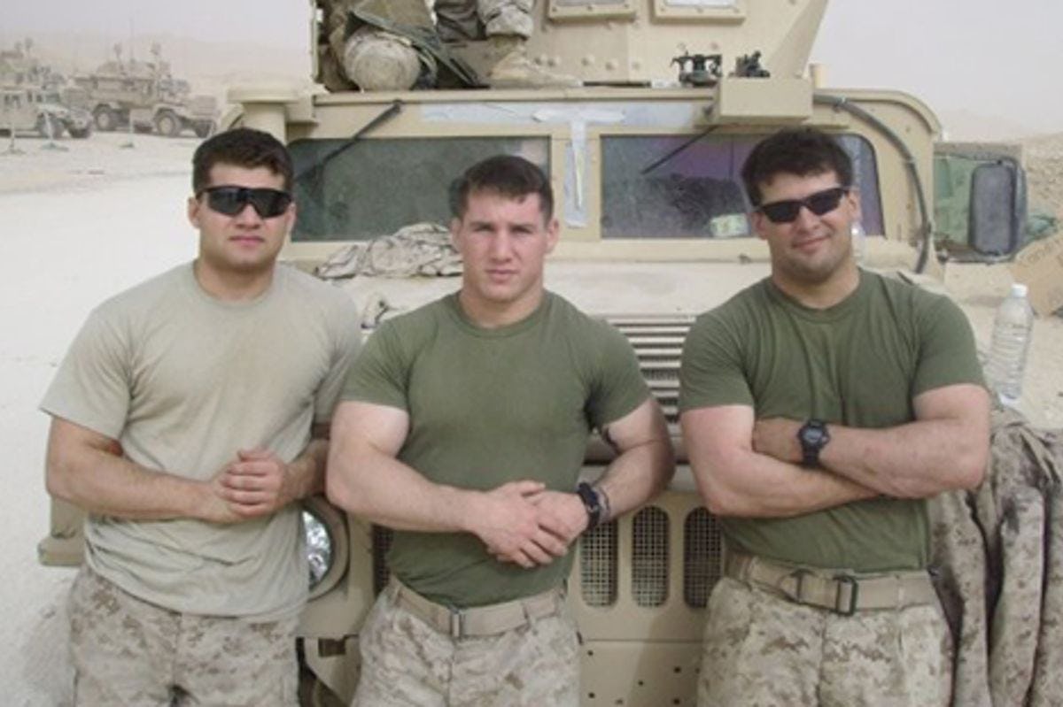 Ryan Bridge and two other servicemen in front of a Humvee in Iraq.
