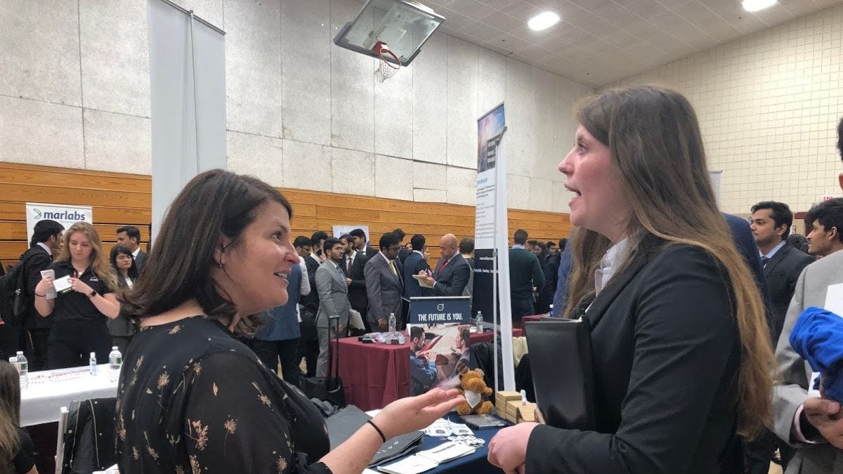Volvo recruiter speaking with a Stevens student