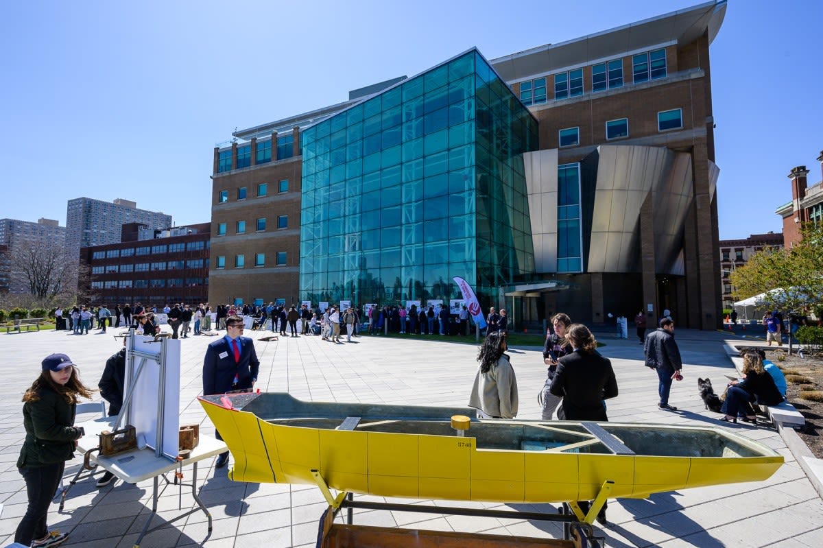 Exterior view of Stevens campus with students at Innovation Expo