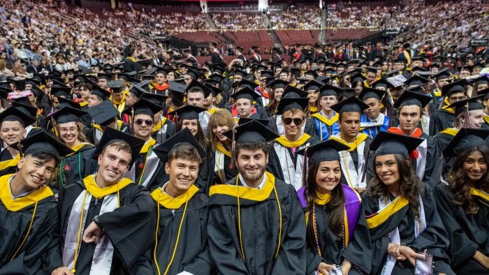 Students smile at Commencement