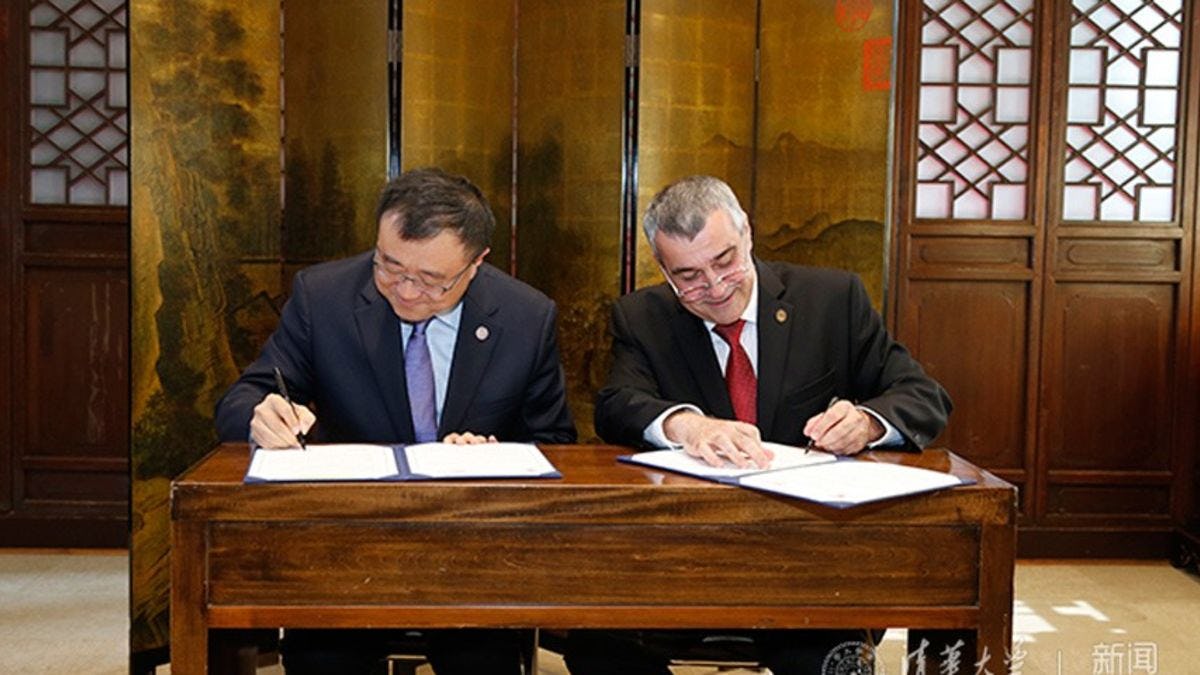 Photo of Dean Yang Bin and Provost Christophe Pierre signing a memorandum of cooperation.