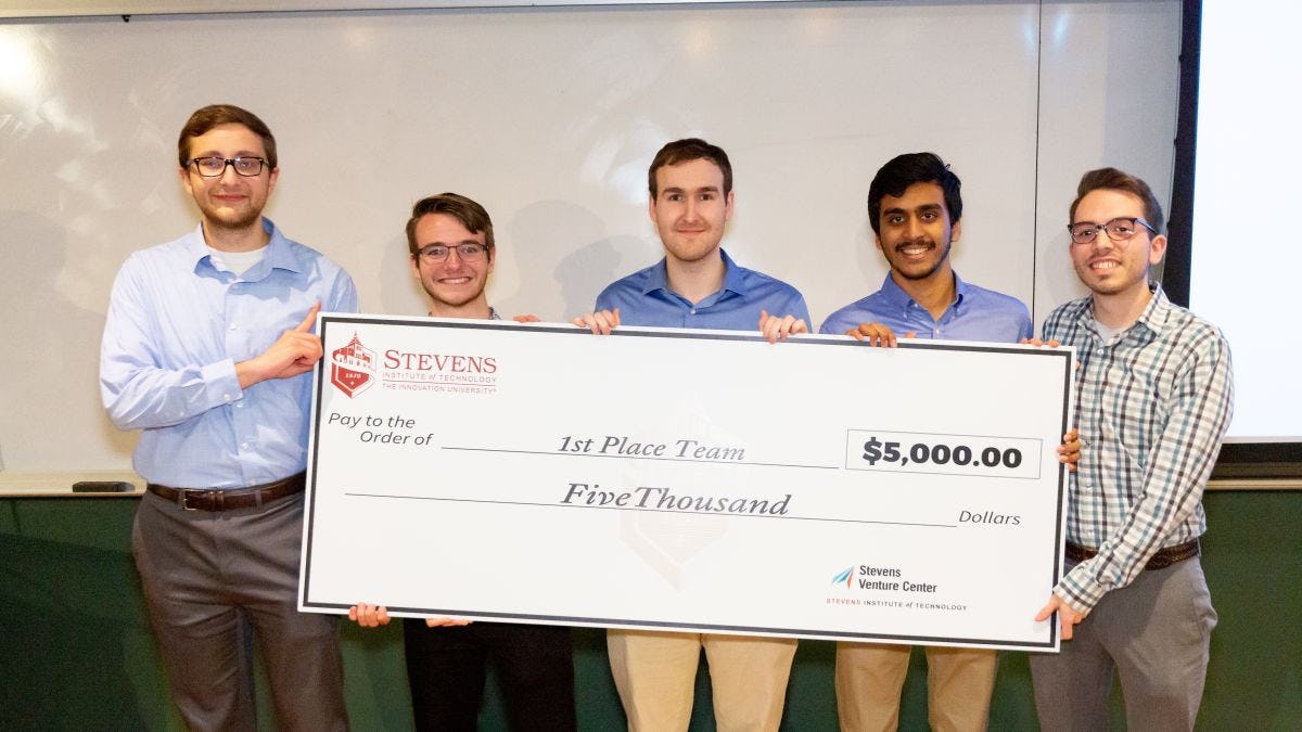 Team R3, comprised of students from Stevens, took first prize in the 2019 HealthTech Hackathon. Team members pose with a ceremonial check.
