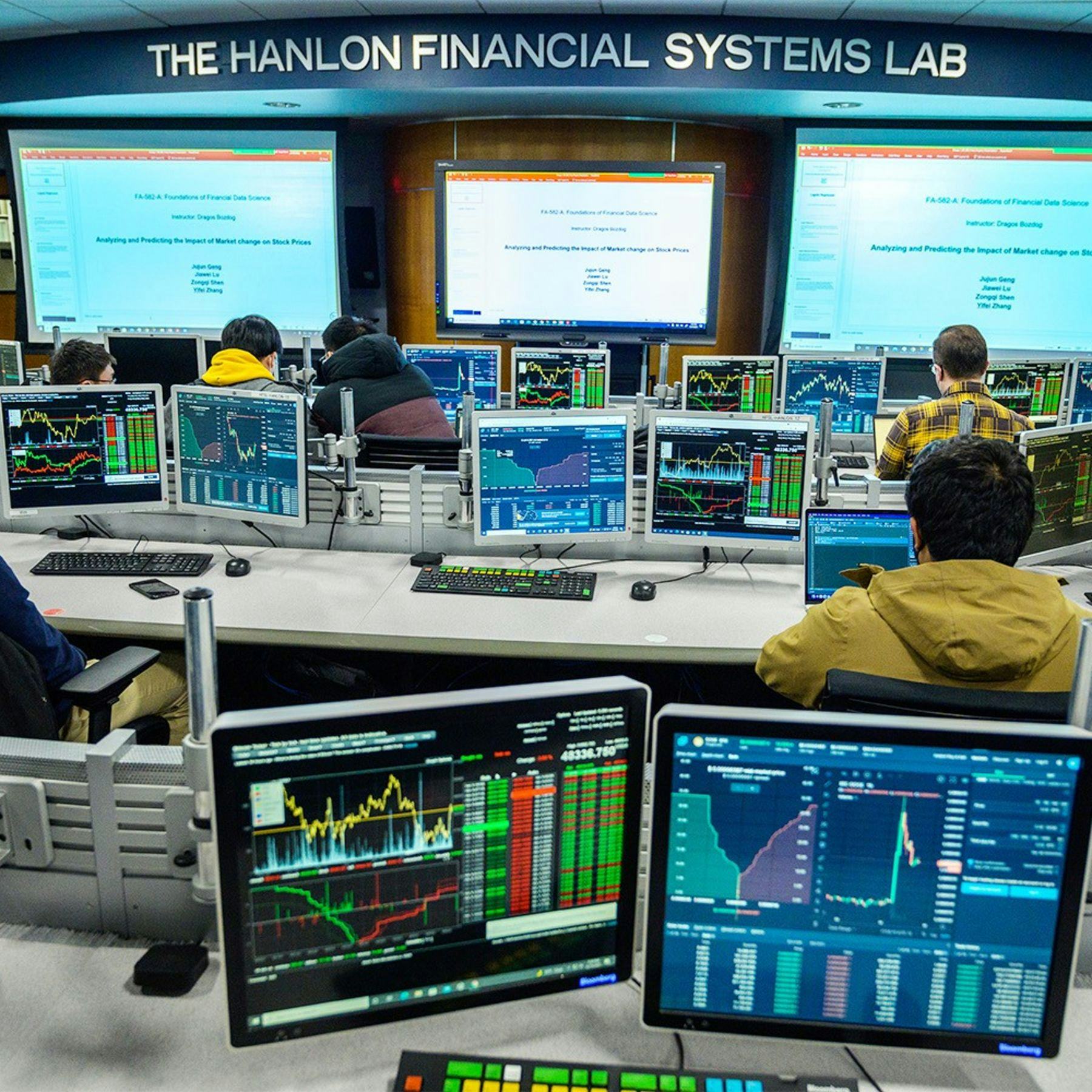 view of Hanlon Center from the back, with computer screens showing stock charts