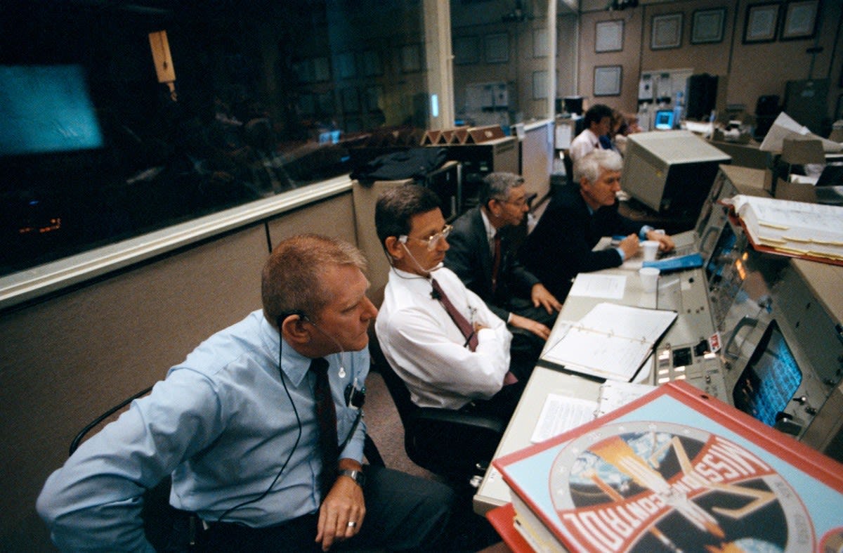 Aaron Cohen in the Mission Control Center