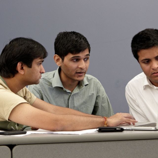 students working on a laptop