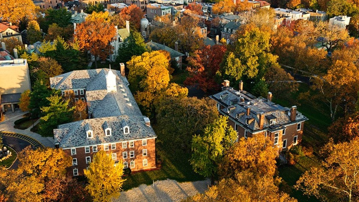 The Stevens campus from overhead. The trees have turned orange and yellow in the fall.
