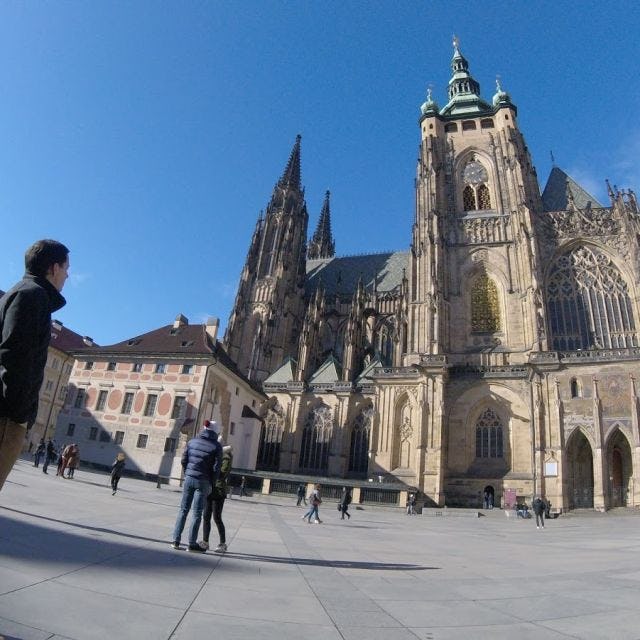 Student next to St. Vitus Cathedral in Prague, Czech Republic