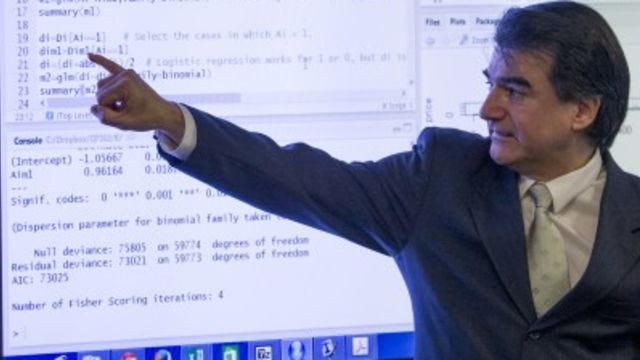 Professor pointing to a line of code